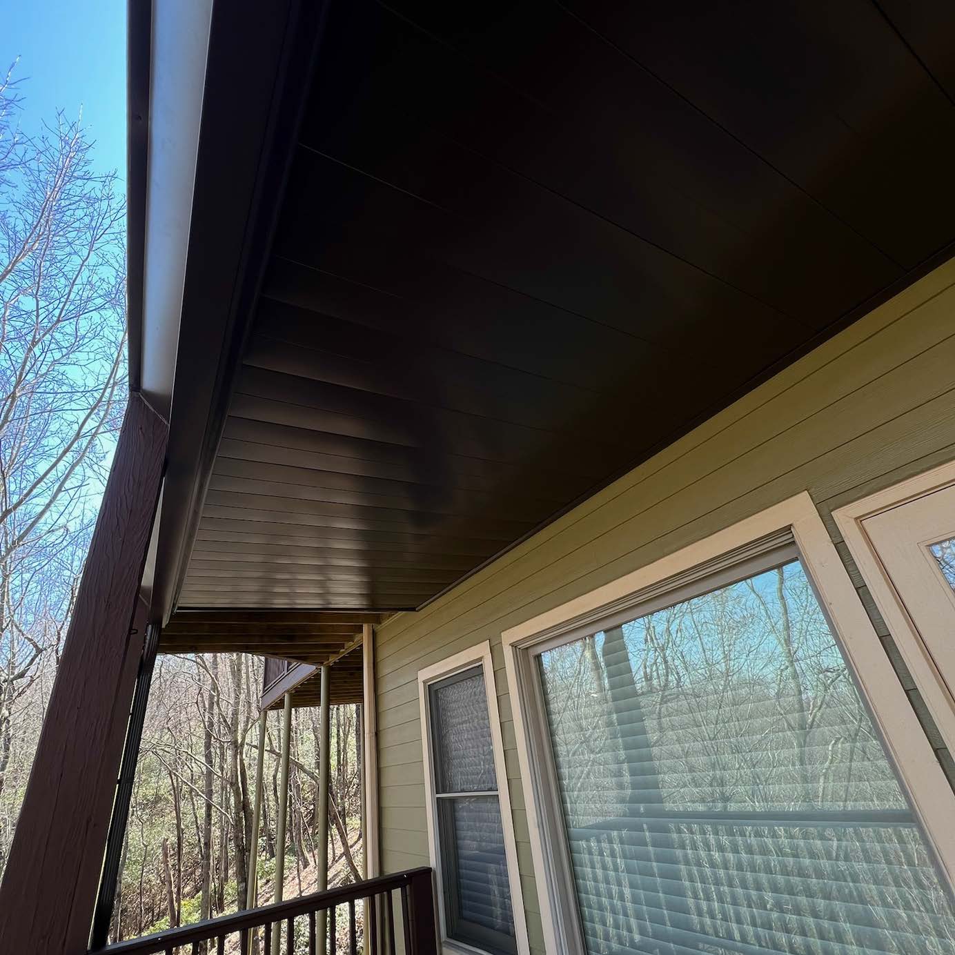 Georgia Luxe Outdoors professional under-deck drainage ceiling system installation on an elevated backyard porch structure in Atlanta.